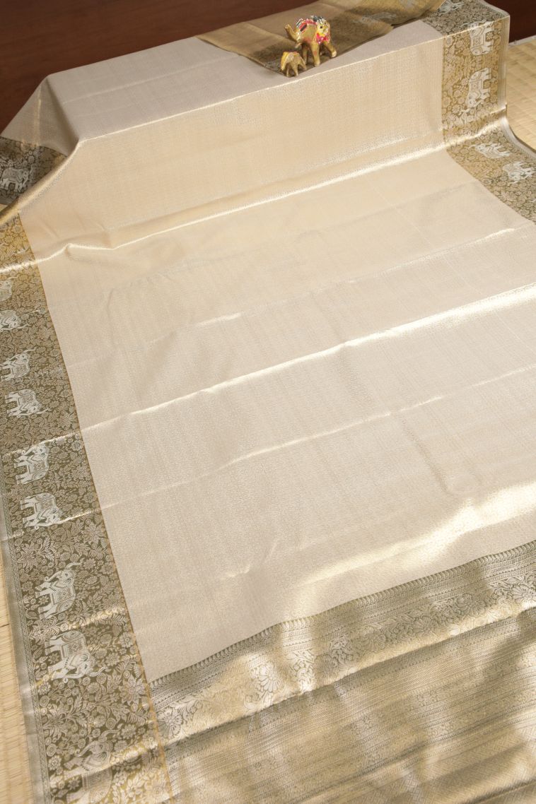 Cream White Tissue Silk Sarees with Silver Zari Floral Patterns view 2