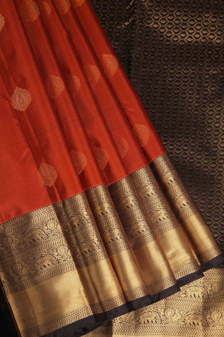 Clay Orange Soft Silk Saree with Gold Zari Thilagam Puttas view 1