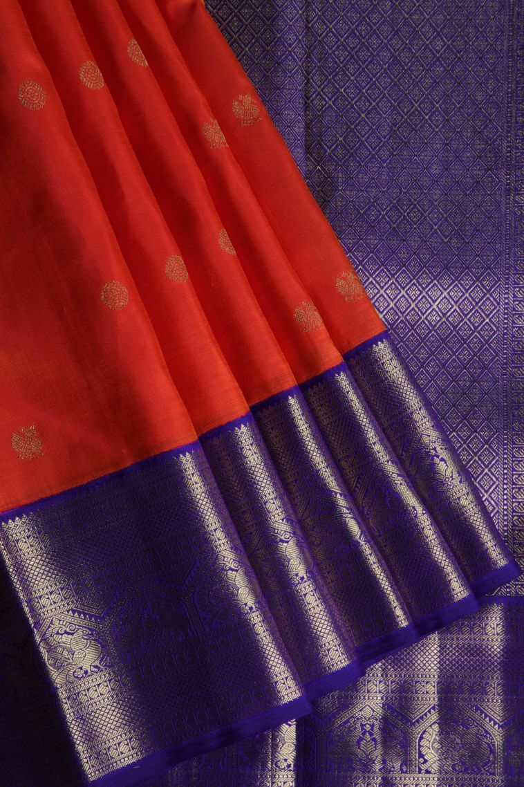 Tiger Orange Kanchipuram Silk Sarees with Gold Zari Peacock Motifs view 1