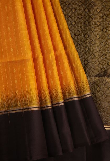 Marmalade Orange Soft Silk Saree with Gold Zari Raindrops Model