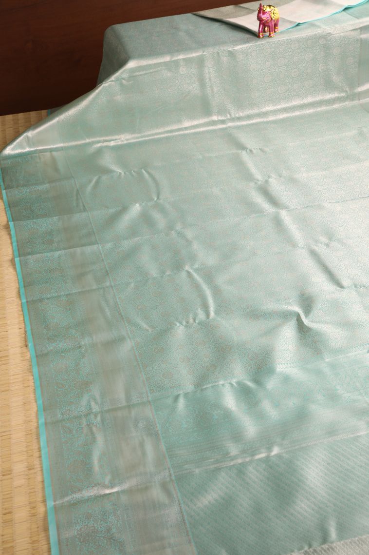Teal Blue Tissue Silk Sarees with Gold Zari Floral Patterns view 2