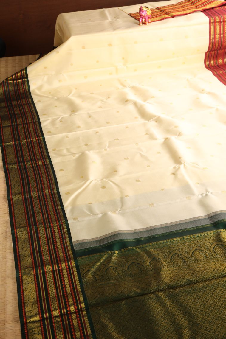 Alabaster White Kanchipuram Silk Sarees with Gold Zari Peacock Motifs view 2